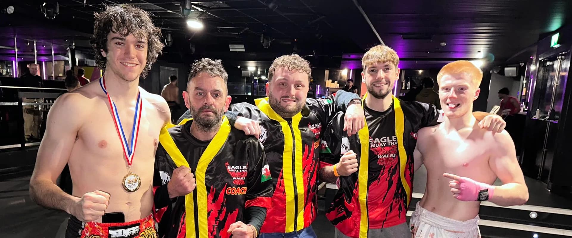 The Eagles Muay Thai team at a fight event