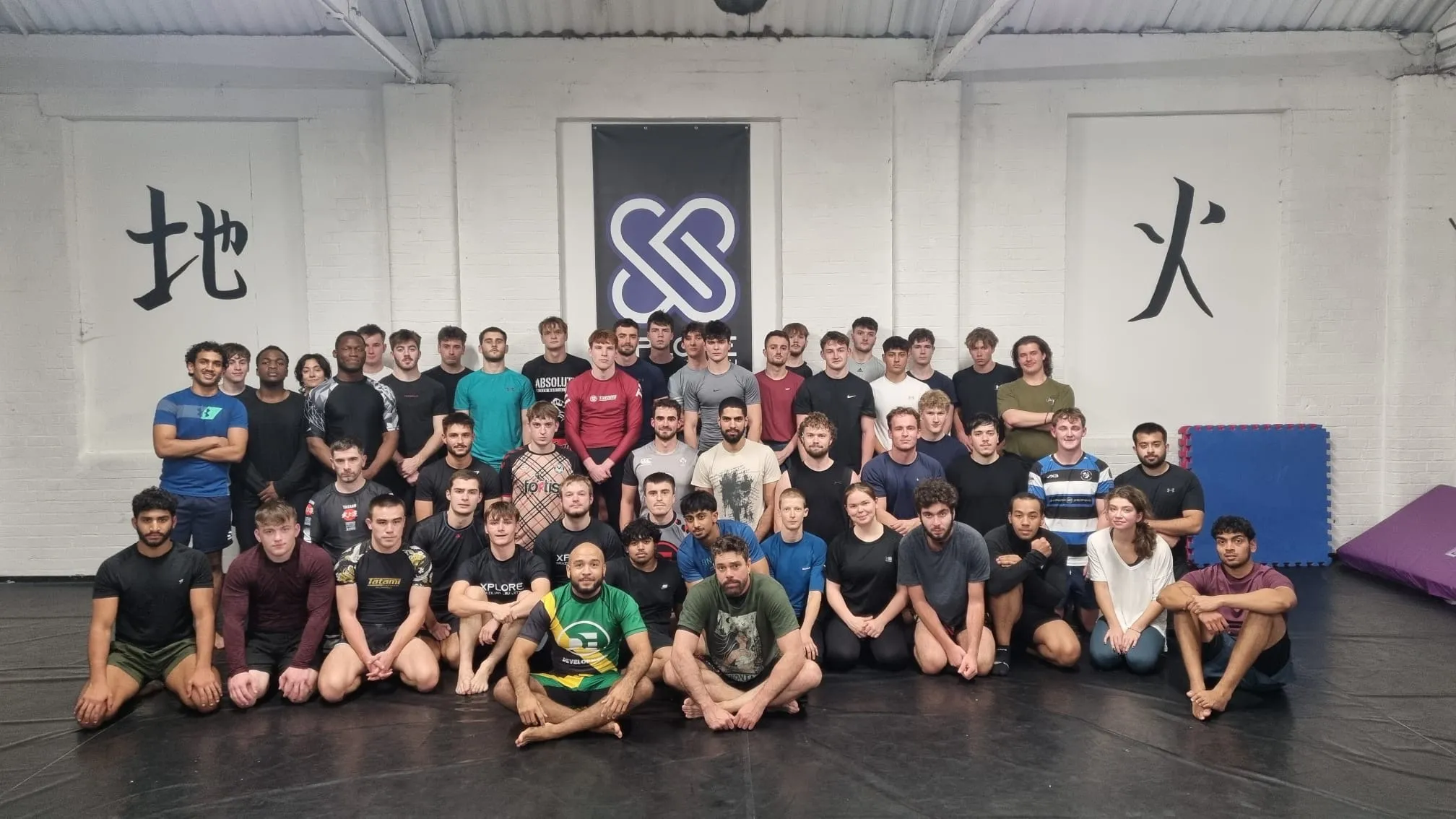 Xplore club members together on the mats