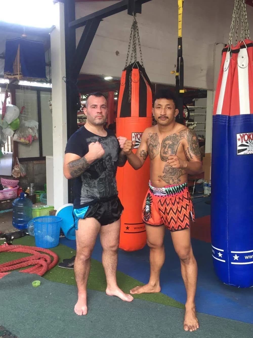 Mat Muay Thai members in a training gym