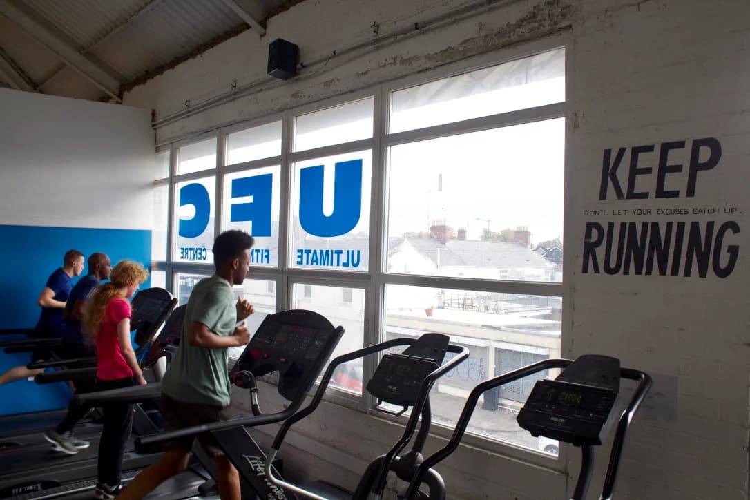 Members using treadmills beside the windows at UFCC