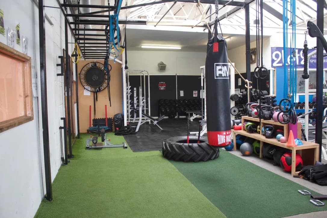 The UFCC functional training floor with sled, punch bag, rings and kettlebells